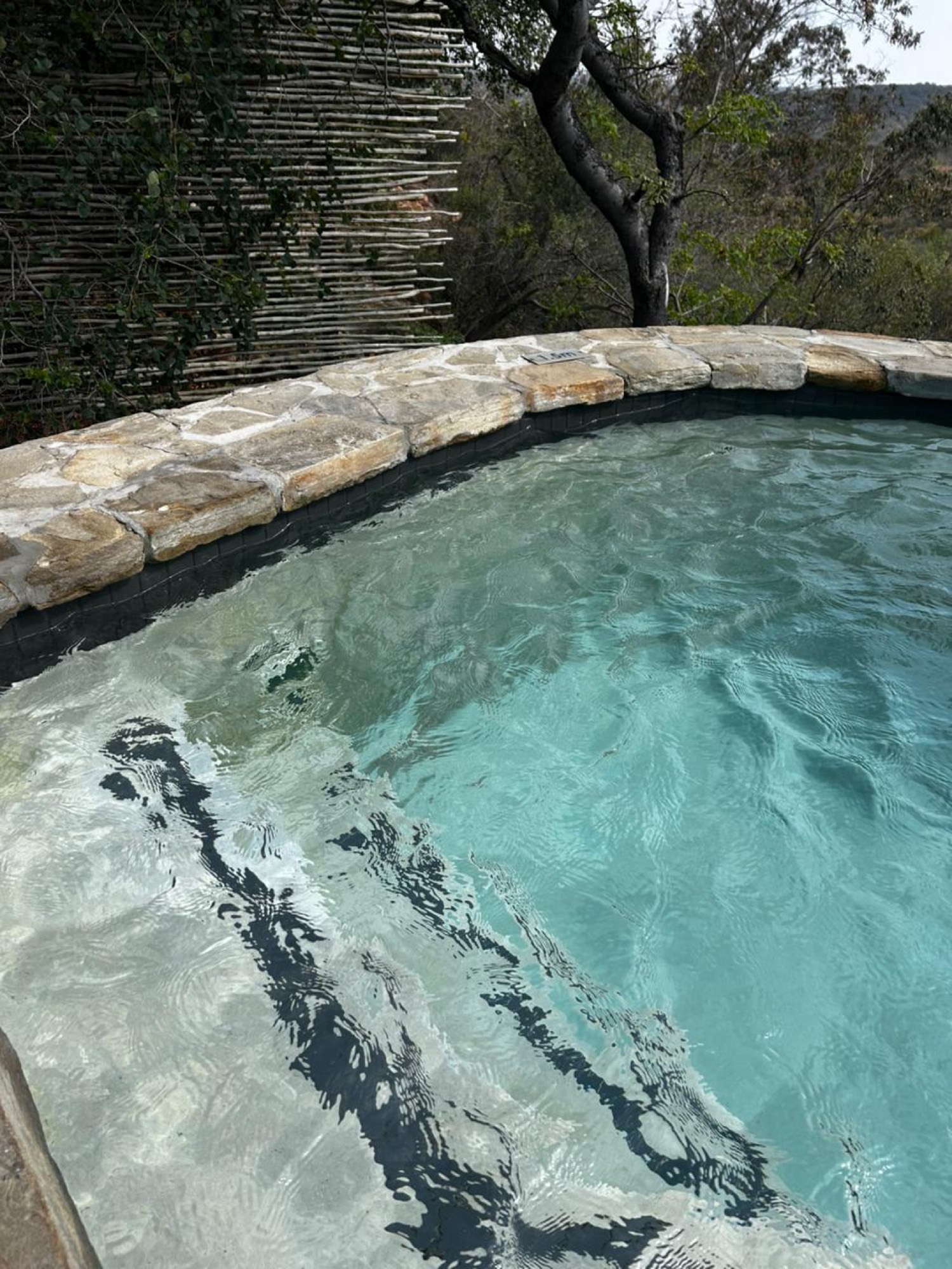 A stone rock pool at a safari lodge